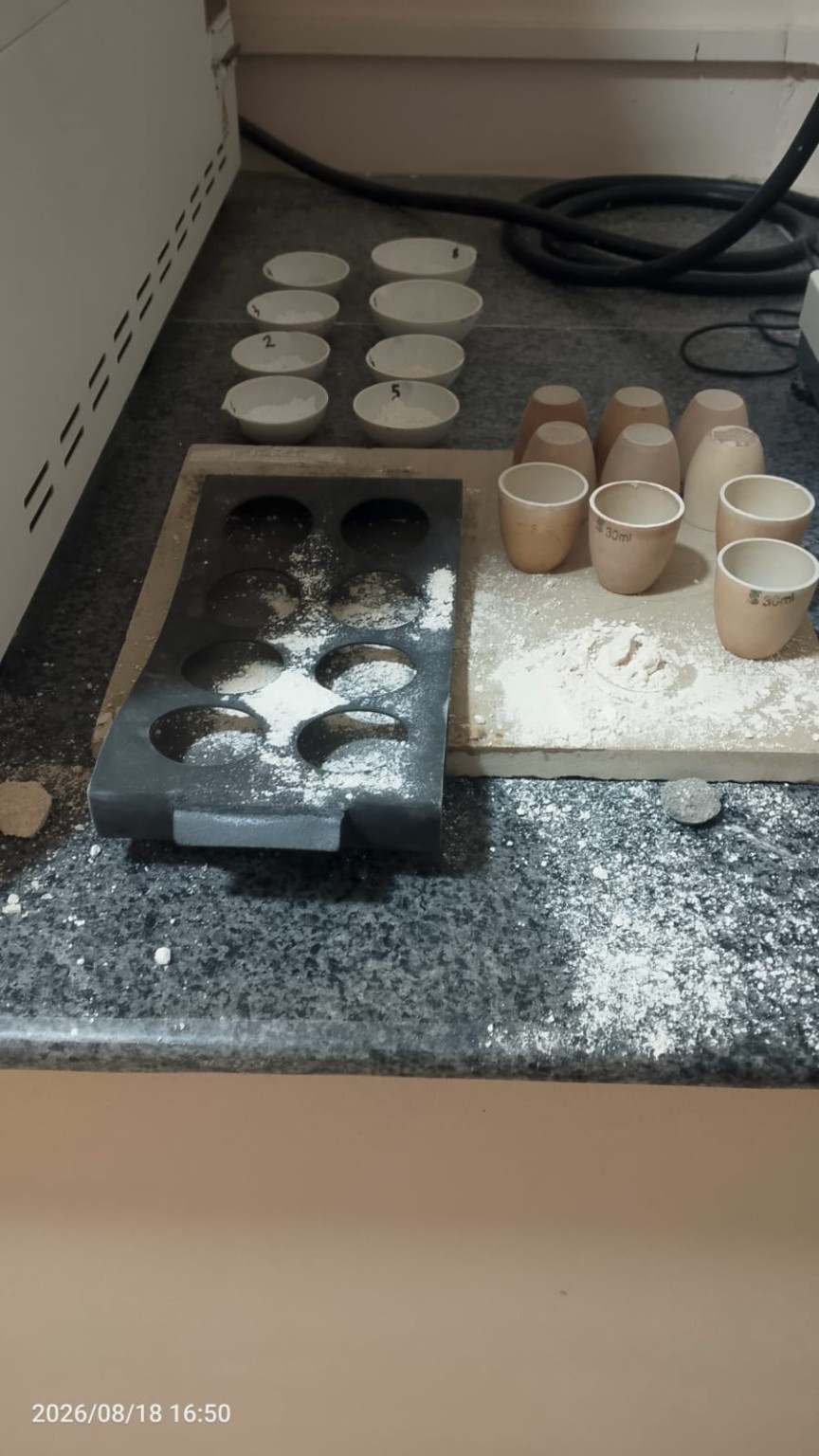 Mineral samples and crucibles on the laboratory preparation bench